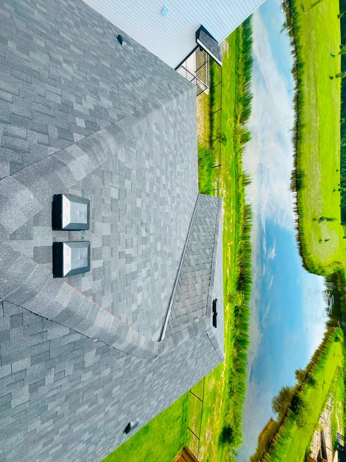 Aerial view of a completed residential shingle roof